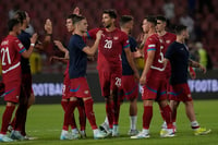 | Photo: AP/Darko Vojinovic : 2024-25 Nations League Football Serbia vs Spain: Serbia's players clasp hands after the match 